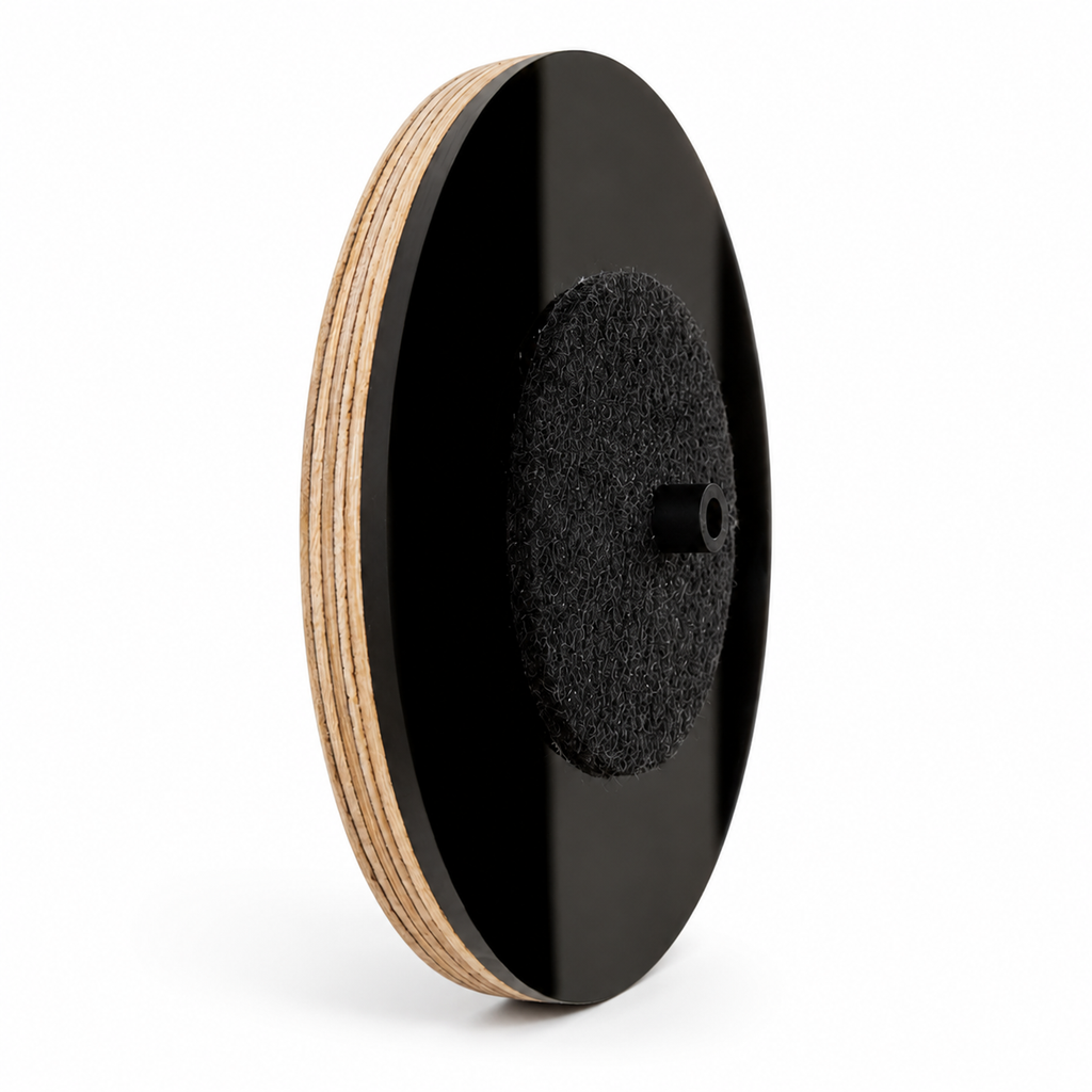 Side profile of round black CentreMount vinyl record wall display with birch plywood edge, black acrylic face, felt centre support and protective centre cap on a white background.